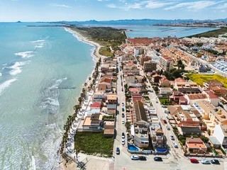 Aerial view of Lo Pagan cityscape with seafront promenade and salt lakes mud baths natural, open-air health spa, located on the northern edge of the Mar Menor, in Murcia, Spain  © Alex Tihonov