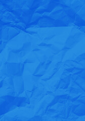 Obraz premium Blue paper with wrinkles and creases.