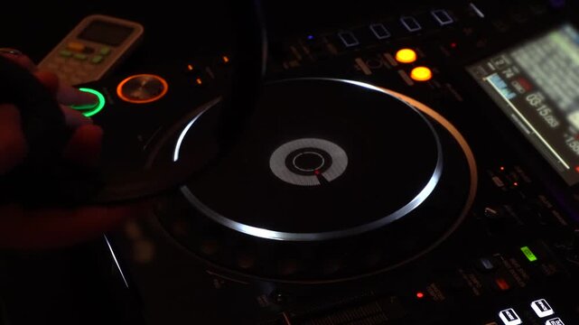 Female DJ Operating DJ Equipment