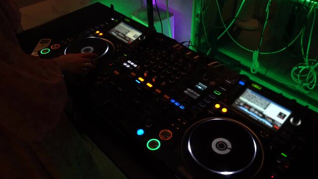 Female DJ Operating DJ Equipment