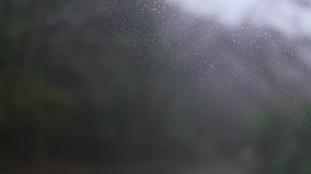 Raindrops are falling on the windshield