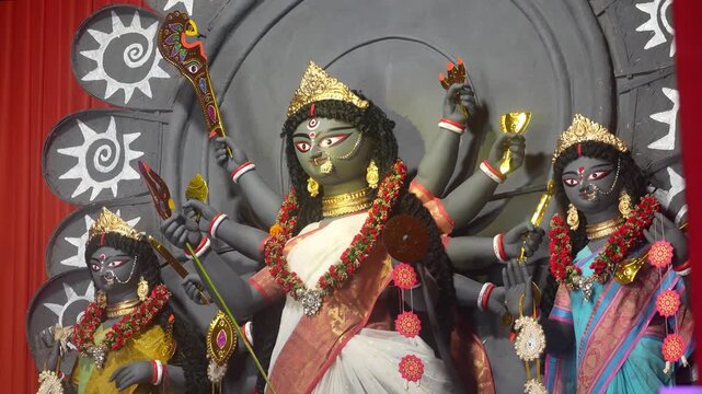 Detailed close up of Durga murti capturing artistic craftsmanship, divine beauty and spiritual significance in a traditional setting.