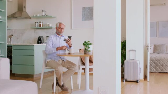 Man, phone and credit card in hotel with payment, travel expense or eft transaction for holiday cost. Mature person, tech and digital banking in accommodation with website fees and bill for vacation.
