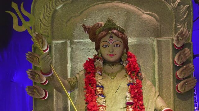 Goddess Durga idol depicted as a queen in India, showing royal posture, powerful expression