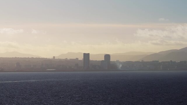 Marseille Sunrise: Golden Hues Over Panoramic Cityscape and Sea