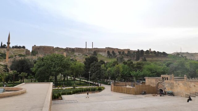 Sanliurfa old town view around popular Balıklıg&ouml;l, fish lake, area with Urfa castle at the top. Urfa is a popular tourist destination in southeastern Turkey