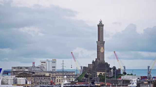 Historic Genoa Lighthouse Guards Busy Port Under Cloudy Sky