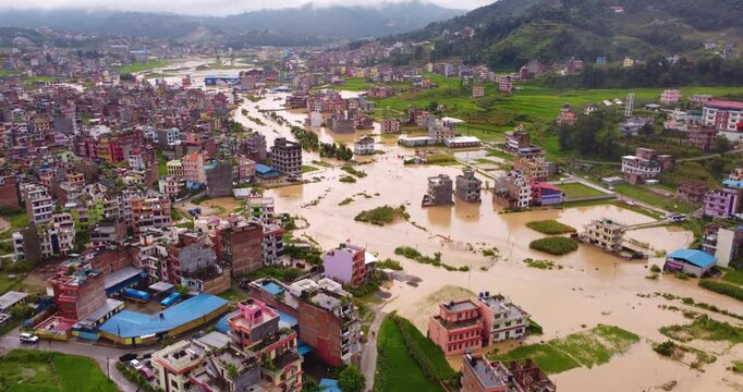 Drone shot of Banepa near Kathmandu, Nepal, with buildings and surrounding land submerged by floodwaters, showing the widespread impact of monsoon rainfall.