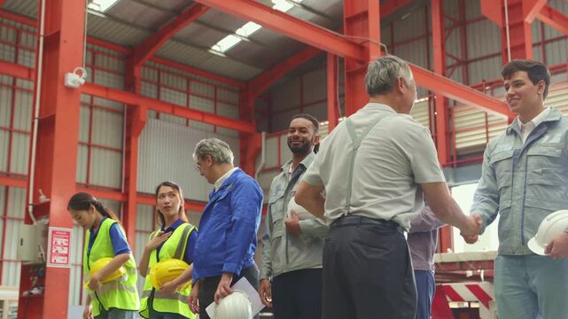 Factory supervisor delivered an inspirational speech before employees began their duties in their departments and workstations on the metal sheet production line.