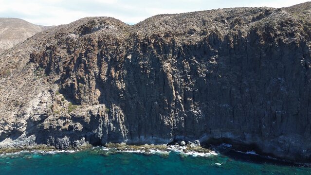 Tenerife coastline with rugged cliffs and clear blue atlantic ocean