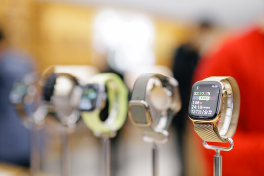 Guangzhou, China - December 31, 2025: Ultra Apple watch Smartwatch on display with blurred shoppers in store digital device