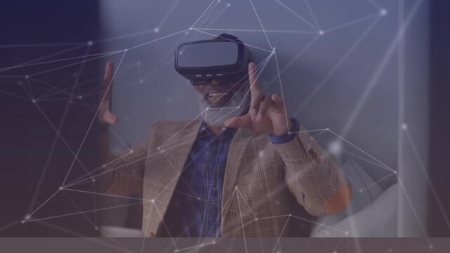 A man is sitting on a couch wearing a virtual reality headset