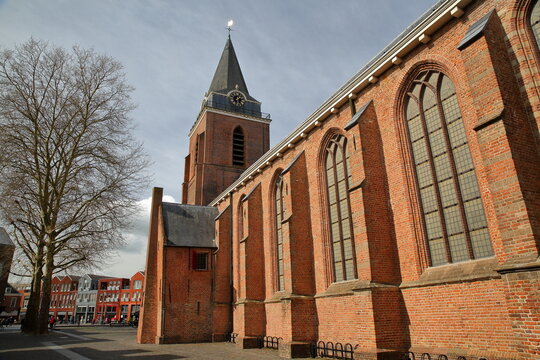 The Petruskerk church and Kerkplein square with historic houses in Woerden, Utrecht, Netherlands