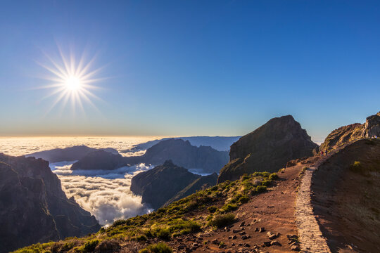 Hiking trail along Pico do Areeiro in Madeira at sunrise