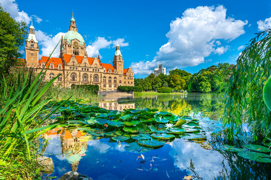 Rathaus Hannover reflected in a lake on a sunny summer day