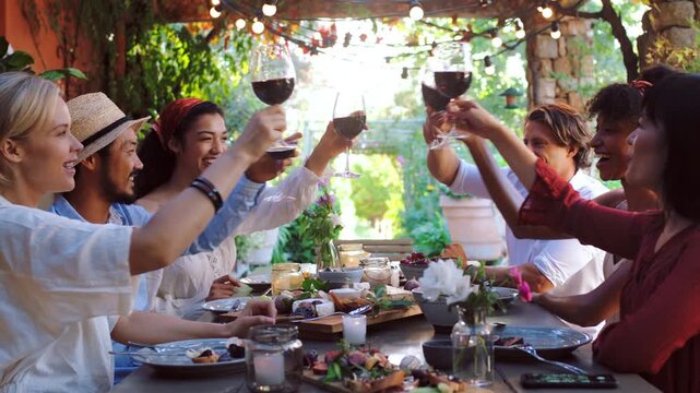 Villa, friends and cheers with wine at lunch for holiday party, reunion celebration and bonding. Food, people and drinks toast outdoor at lodge for social gathering, vacation trip and group gratitude