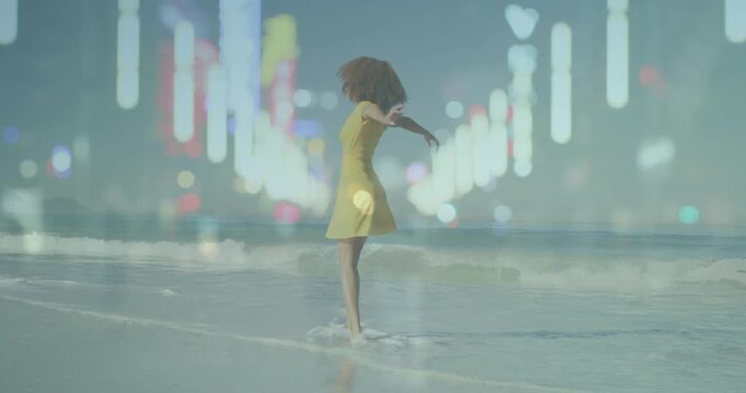 Female dancer stepping into surf, turning, twirling while light streaks, bokeh creating fashion ad