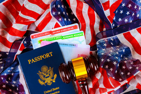 Documents symbols of citizenship legal status on flag background in home setting