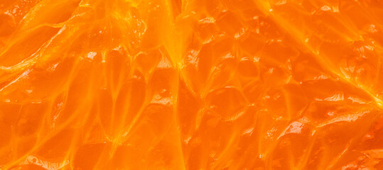 Macro shot of fresh orange pulp texture background,Extreme close-up macro photography of fresh juicy orange fruit pulp. The image highlights the vibrant orange texture, translucent juice vesicles,