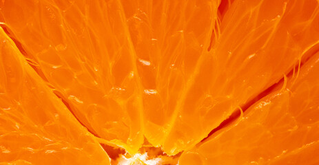 Macro shot of fresh orange pulp texture background,Extreme close-up macro photography of fresh juicy orange fruit pulp. The image highlights the vibrant orange texture, translucent juice vesicles, © banjongseal324