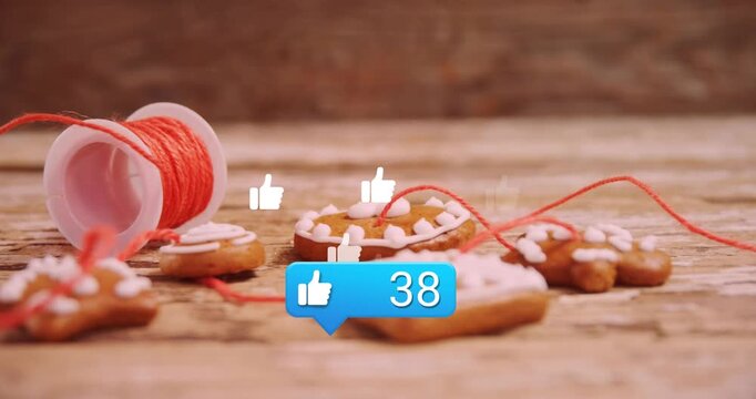 Animation of media icons over christmas cookies