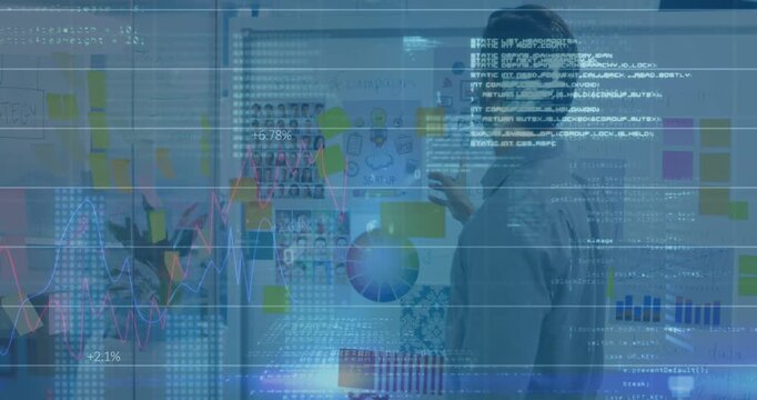 Animation of data processing over caucasian businessman in office