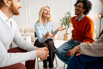Fototapeta premium Diverse people participating in laughing group therapy session