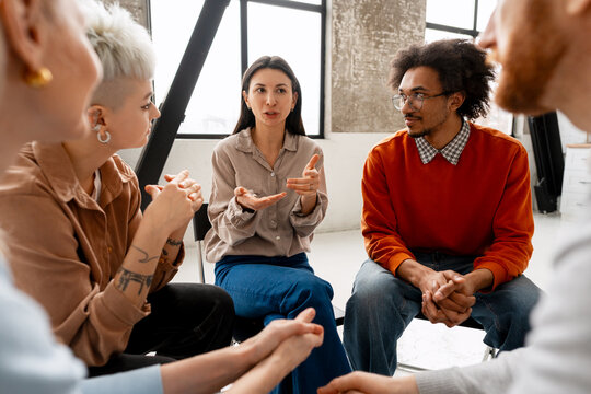 Diverse group of people discussing ideas at a meeting