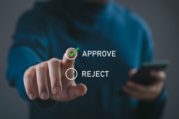Obraz premium Business approval decision concept with hand selecting approve option on digital interface. Workflow authorization, online confirmation, compliance review, and management decision process.