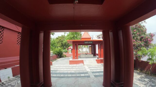 Sacred White Marble Shiv Lingam Established in a Peaceful Temple Courtyard with Inscribed Stone Slabs