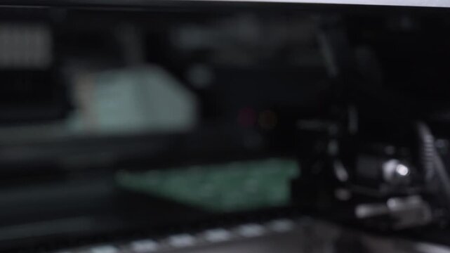 Robotic production of printed circuit board. Automated manufacturing of electronic chips. Close-up of a part of the production line in the process of manufacturing microchips.