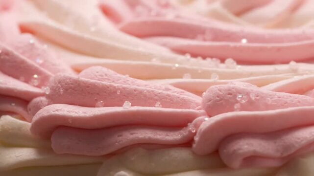 Pink and white frosting closeup.
