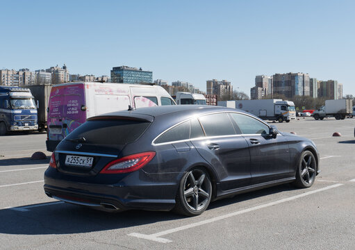 Black Mercedes-Benz CLS-Class 350 (C218) sedan parked on street. Exterior of a black Mercedes-Benz CLS 350 W218 Shooting Brake parking lot in the center of the town. Germany premium car. 