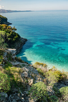 Scenic Coastal View with Turquoise Blue Sea and Clear Sky. Shpella e P&euml;llumbave, Ksamil, Albania.