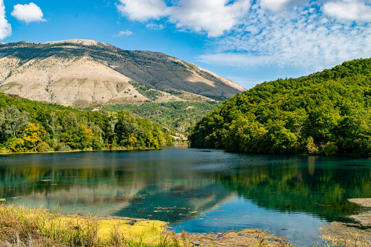 Tranquil Mountain Lake Surrounded by Lush Green Forest. Blue eye Albania