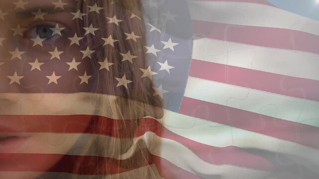 Animation of flag of united states of america over happy african american man on beach