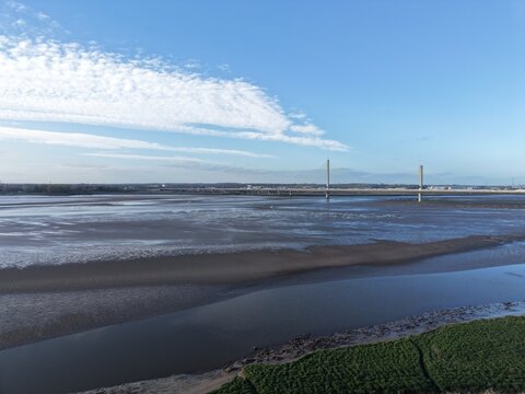 River Mersey Aerial View of Bright Water and Natural Grassland Coastline