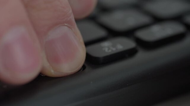 Closeup fingertip pressing delete key, server room vibe with steady hands, technician initiates secure wipe and backup check while monitor briefly flashes red, methodical procedure