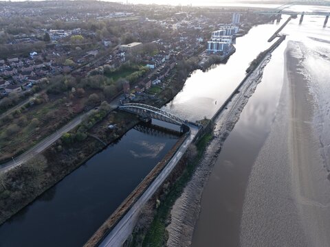 River Mersey Aerial View of Sunlit Riverbank and Natural Meadow Areas