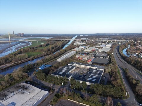 River Mersey Aerial View of Bright Water Surface and Grassland Plains
