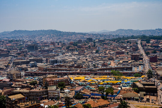 Elevated view of Owino Market and central Kampala under a hazy sky