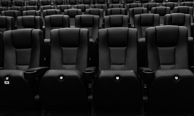Fototapeta premium Empty black and white cinema seats in modern theater