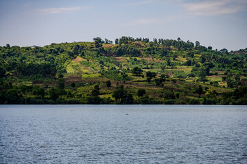 Lake shoreline and green hills near Mbarara in western Uganda © Emad Aljumah