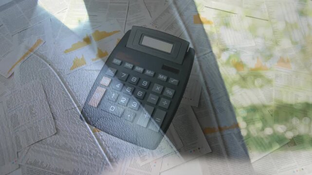 Animation of falling calculator on reports over cropped hands of caucasian man buckling seatbelt