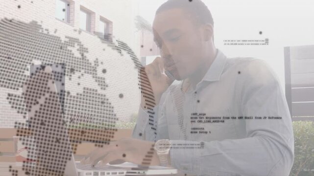 Man taking call, typing on laptop, rotating dotted globe, code overlays aiding business data entry