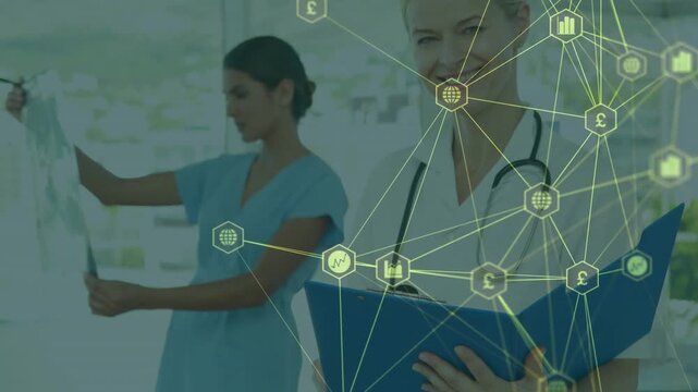 Nurse holding xray to light for health review, doctor shifting folder and smiling, overlay moving