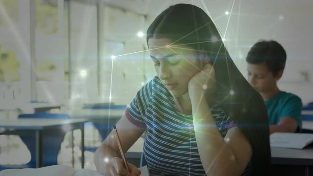 Teen girl glancing, propping chin and writing in notebook for school, nodes passing around peers