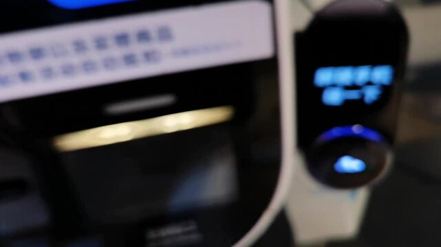 Blurred mall self-checkout payment footage with ambient sound, customers scan QR code, privacy-safe commercial B-roll.