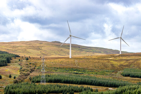 Pylons, electricity power lines and wind turbines at the Freasdail Wind Farm on the Kintyre Peninsula, Argyll & Bute, Scotland UK
