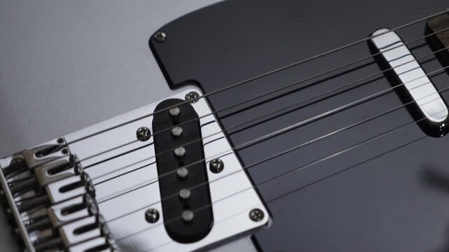 Electric grey guitar music background, closeup